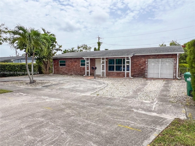 single story home featuring a garage