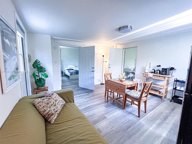 dining area with hardwood / wood-style floors