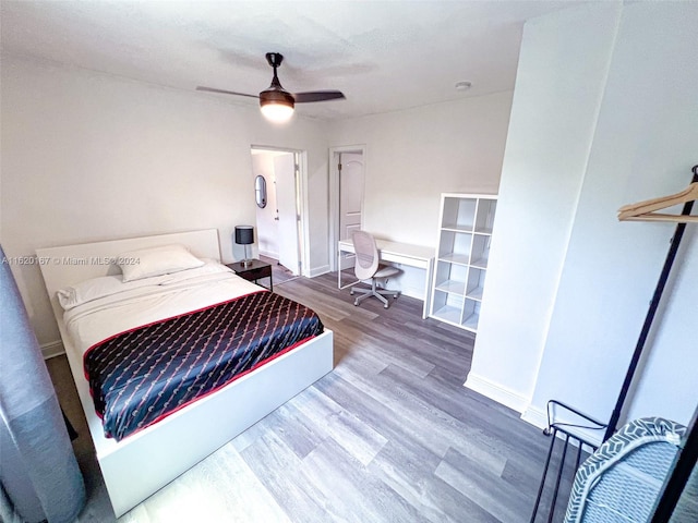 bedroom featuring hardwood / wood-style floors and ceiling fan