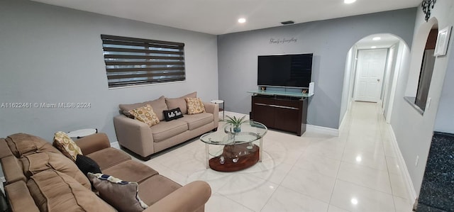 living room with light tile patterned floors