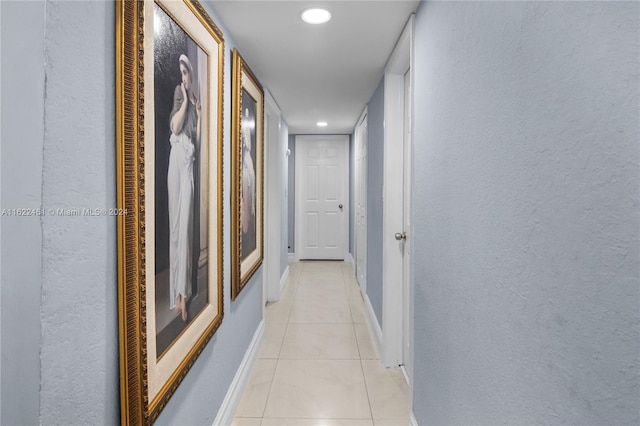 hall with light tile patterned flooring