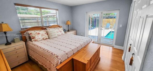 bedroom with access to outside, light hardwood / wood-style flooring, and french doors