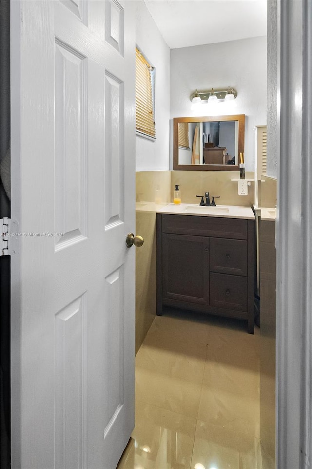 bathroom featuring tile patterned flooring and vanity