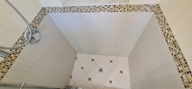 bathroom with a tile shower