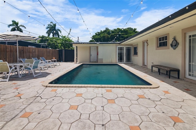 view of swimming pool with a patio