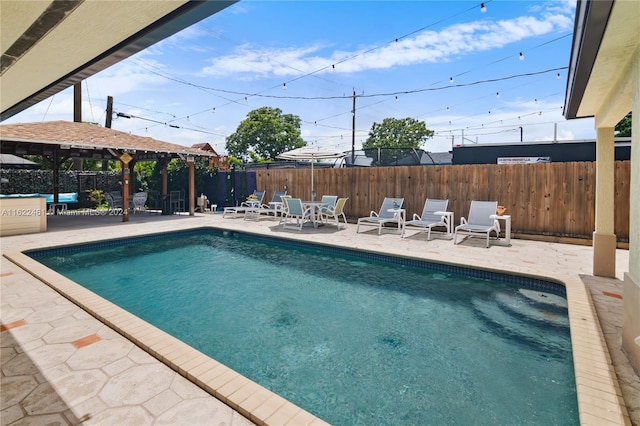 view of swimming pool featuring a patio