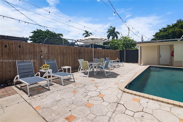 view of swimming pool featuring a gazebo and a patio