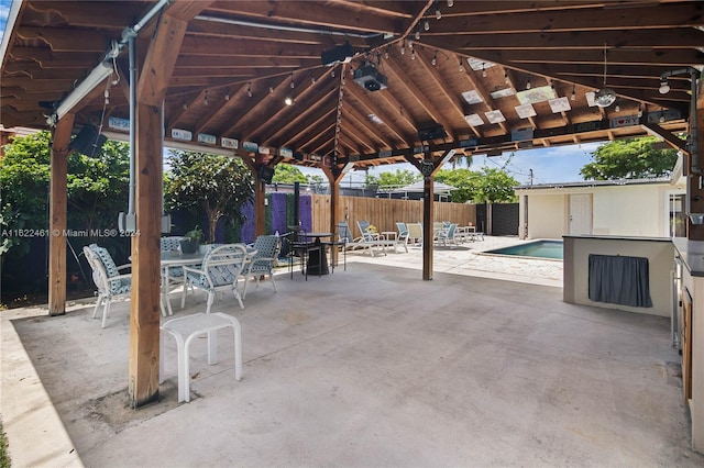 view of patio with a gazebo and a community pool