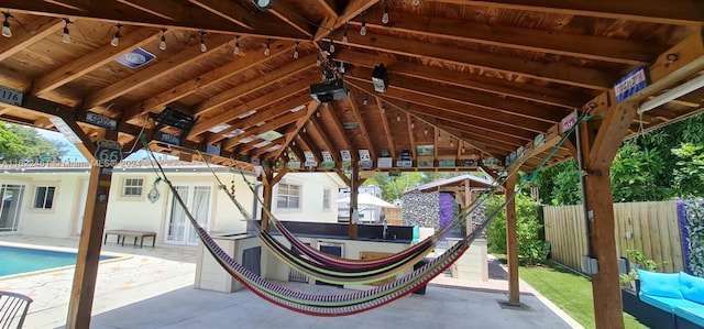 view of patio with a gazebo and a fenced in pool