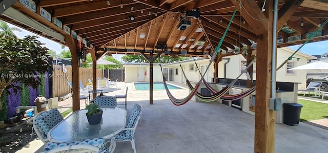 view of patio with a gazebo and a fenced in pool