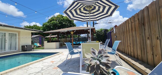 exterior space with a fenced in pool