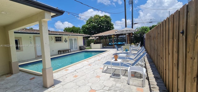 view of swimming pool featuring a patio area