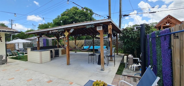 view of patio with a gazebo and a bar