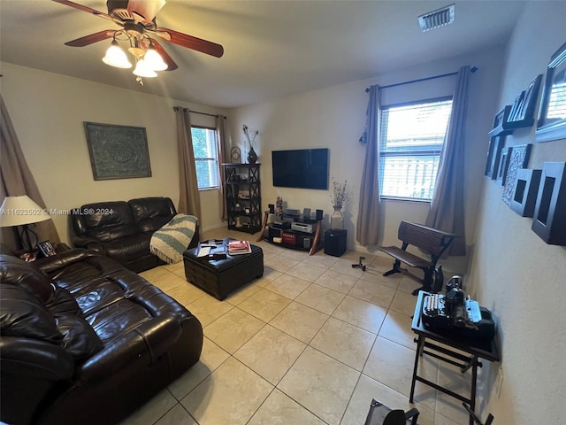 living room with ceiling fan and light tile patterned floors