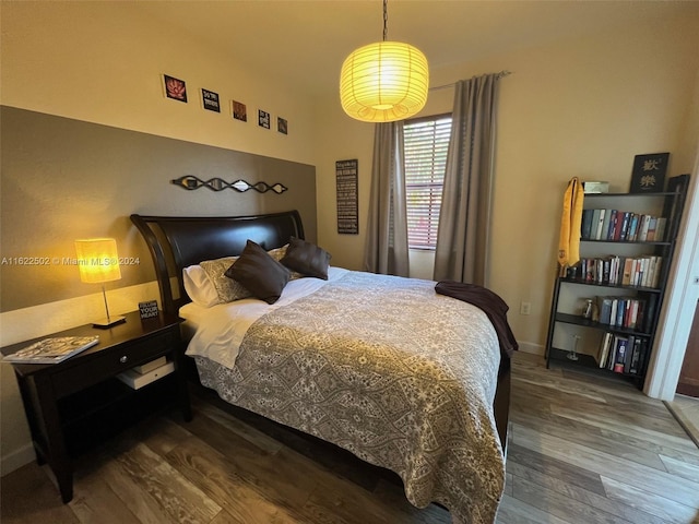 bedroom featuring dark wood-type flooring