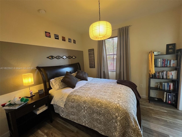 bedroom featuring dark hardwood / wood-style flooring