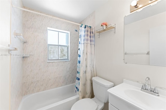 full bathroom with vanity, shower / tub combo with curtain, and toilet