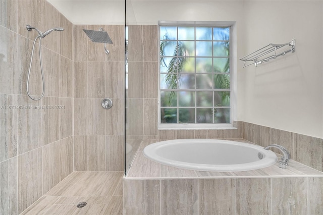 bathroom with independent shower and bath