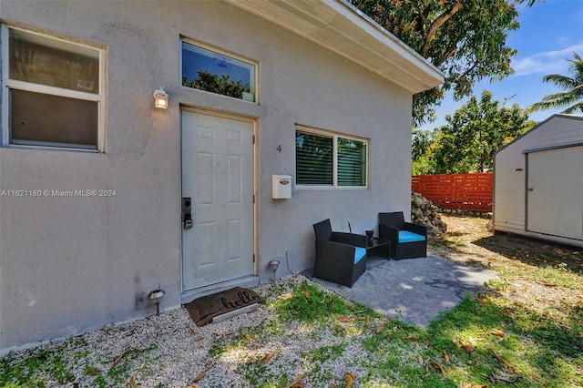 doorway to property with a patio area