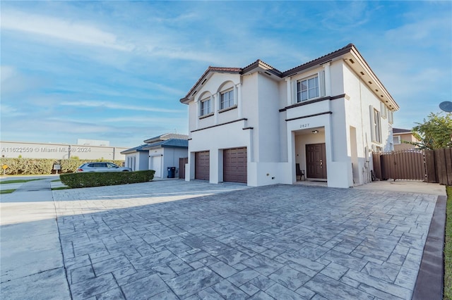 view of side of property with a garage