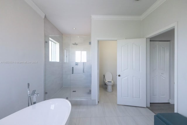 bathroom featuring independent shower and bath, tile patterned floors, toilet, and ornamental molding