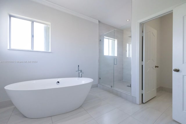 bathroom with tile patterned floors and separate shower and tub