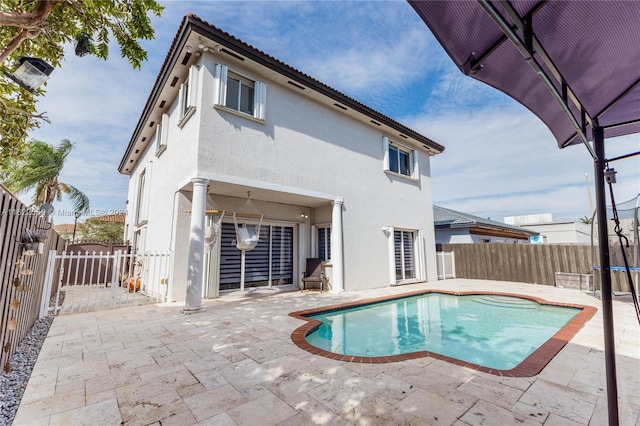 view of swimming pool featuring a patio area