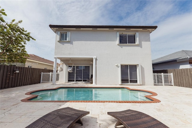 view of swimming pool featuring a patio