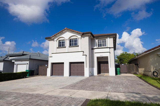 mediterranean / spanish-style house featuring a garage