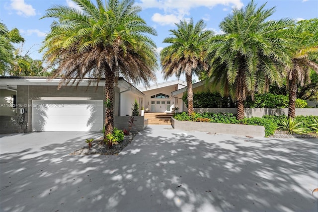 view of front of house featuring an attached garage and concrete driveway