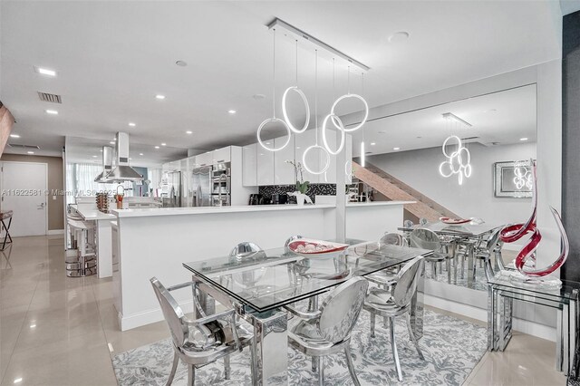 dining area with light tile patterned floors