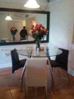 dining space featuring wood-type flooring