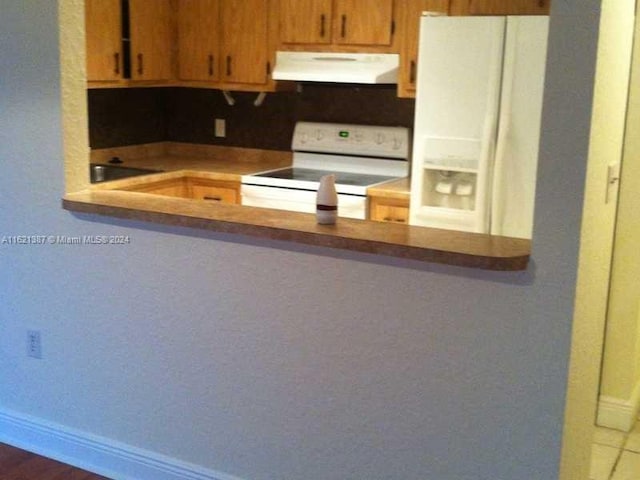 kitchen featuring extractor fan, white appliances, and sink