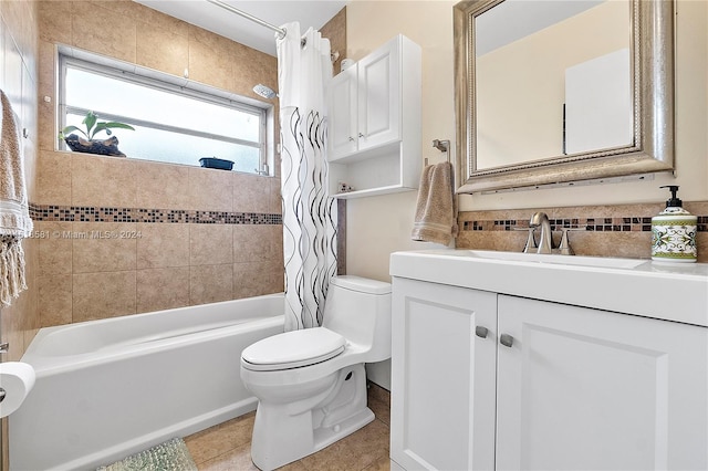 full bathroom with tile patterned flooring, vanity, toilet, and shower / bath combo with shower curtain