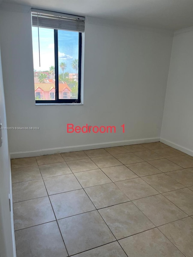 empty room featuring light tile patterned floors