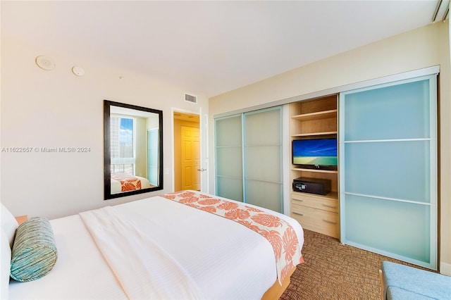 bedroom featuring a closet and carpet flooring