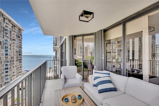 balcony featuring a water view