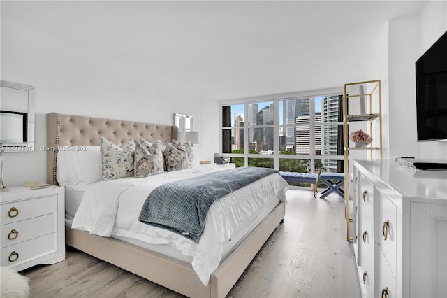 bedroom with light wood-type flooring