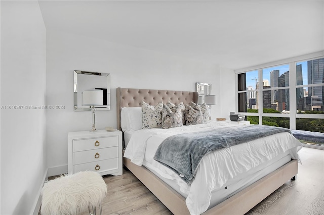 bedroom with light hardwood / wood-style flooring