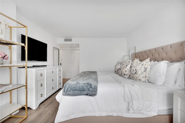 bedroom with light wood-type flooring