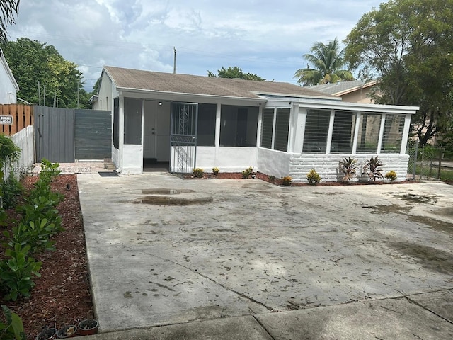 back of property featuring a sunroom