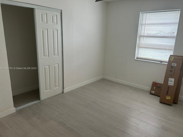 spare room with light hardwood / wood-style floors