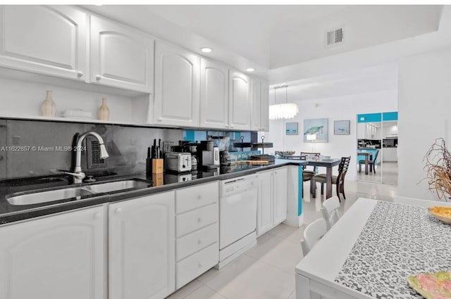 kitchen with white cabinets, decorative light fixtures, sink, and white dishwasher