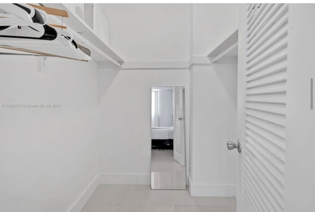 walk in closet featuring light tile patterned floors