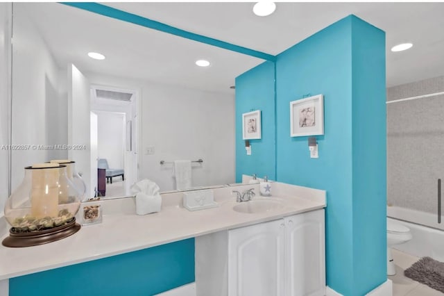 full bathroom featuring tile patterned floors, vanity, bathing tub / shower combination, and toilet