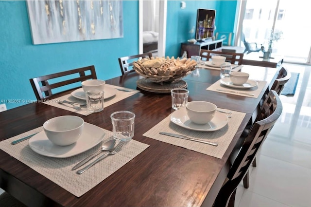 dining space with wood-type flooring