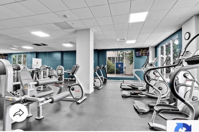 workout area featuring a drop ceiling