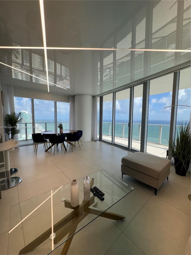 community lobby featuring a view of the beach and a water view