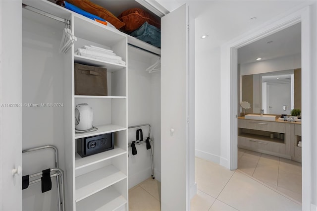 interior space with sink and light tile patterned floors