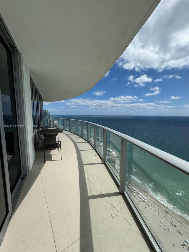 balcony featuring a water view